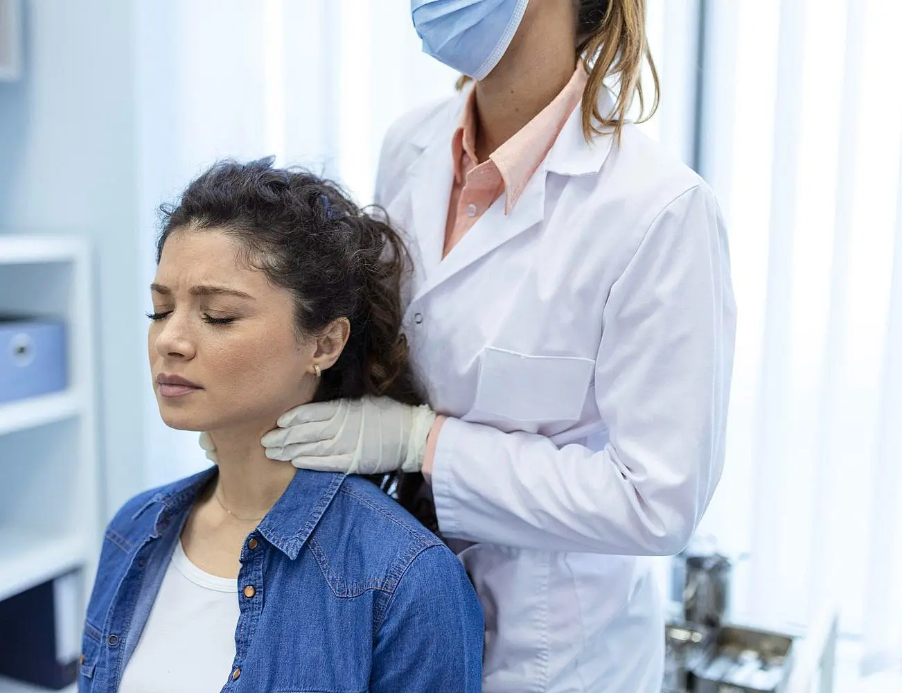 a doctor rehabilitating jaw of young woman At Paige Orthodontics in Kingwood, TX