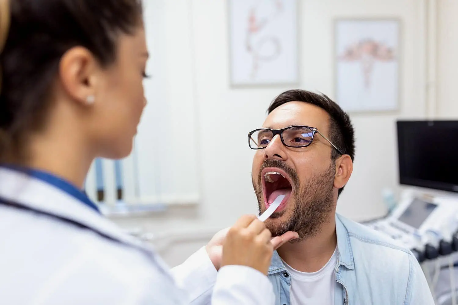 a man undergoing orthodontic treatment to correct tongue thrust issues at Paige Orthodontics in Kingwood, TX
