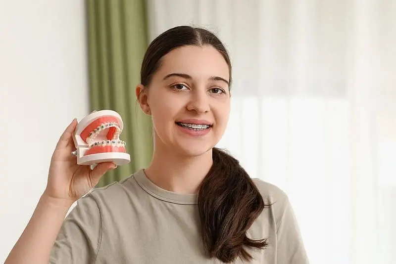 a woman smile feel benefit with braces from Paige Orthodontics in Kingwood, TX
